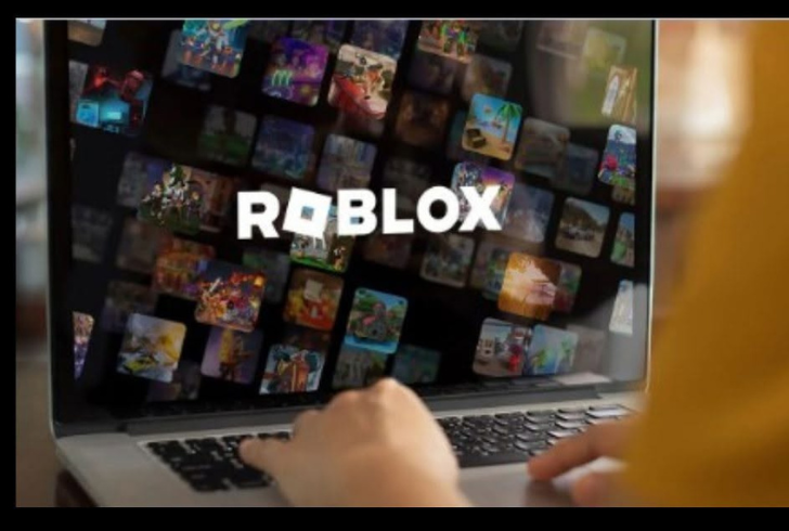 Child opening Roblox on a Laptop